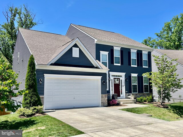 1422 Silver Oak Ln, Arnold, MD 21012 - colonial house featuring concrete driveway, a garage, a shingled roof, and stone siding