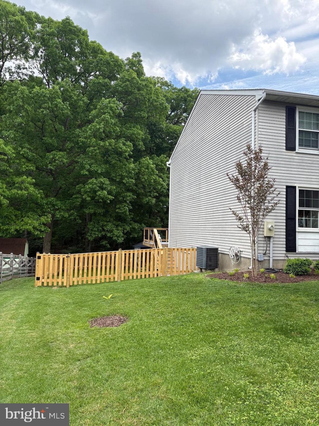 view of side of home with cooling unit