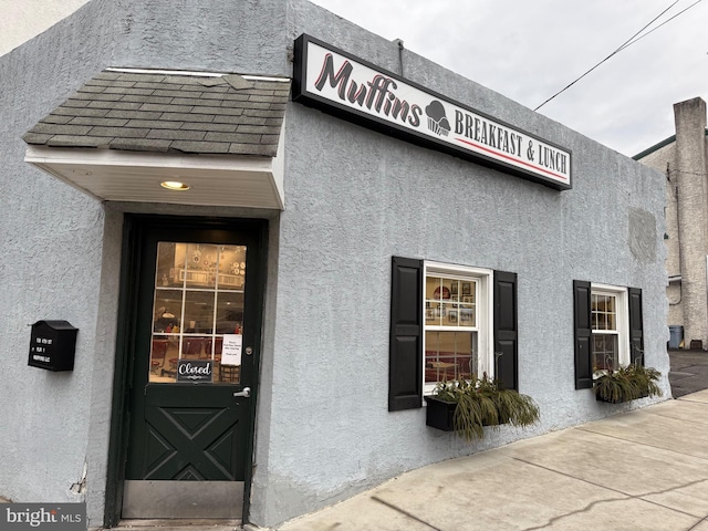 138 W 4th St, Bridgeport, PA 19405 - property entrance featuring stucco siding