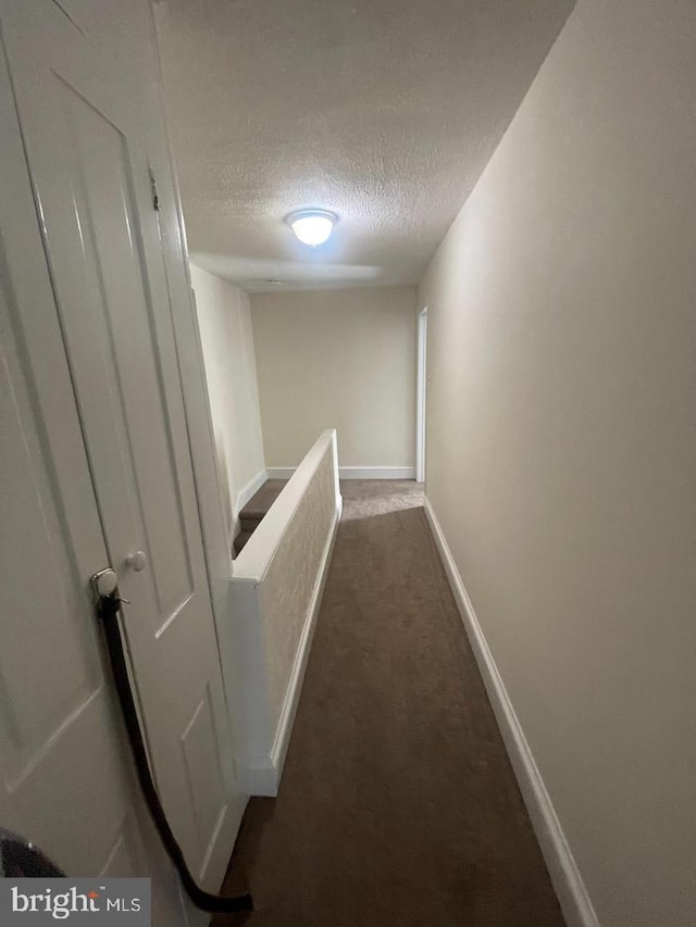 138 W 4th St, Bridgeport, PA 19405 - hall featuring a textured ceiling, carpet flooring, and baseboards