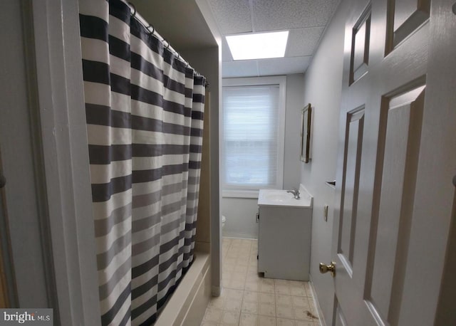 138 W 4th St, Bridgeport, PA 19405 - bathroom featuring vanity, tile patterned floors, shower / tub combo with curtain, baseboards, and a drop ceiling