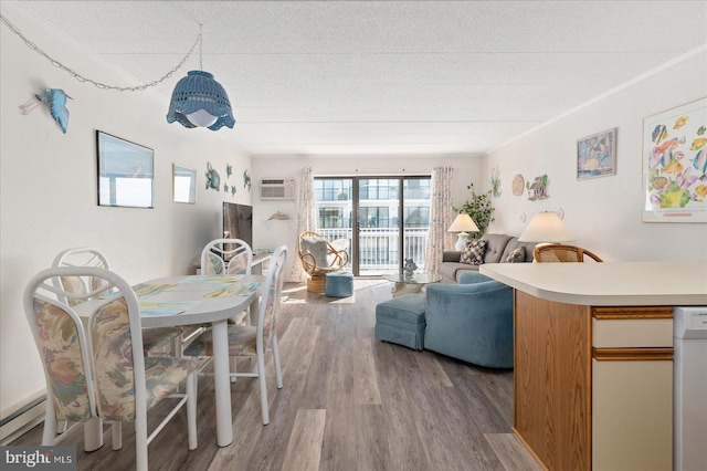 8 35th St Unit 401, Ocean City, MD 21842 - living room featuring wood finished floors, a baseboard radiator, and a textured ceiling