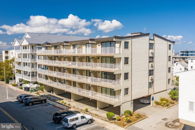 8 35th St Unit 401, Ocean City, MD 21842 - view of apartment building / complex featuring uncovered parking