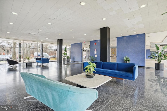 lobby featuring a wall of windows and recessed lighting