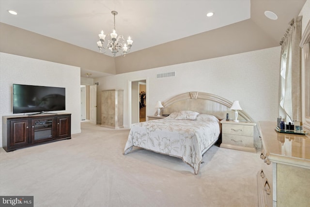 bedroom with a chandelier, light colored carpet, and recessed lighting