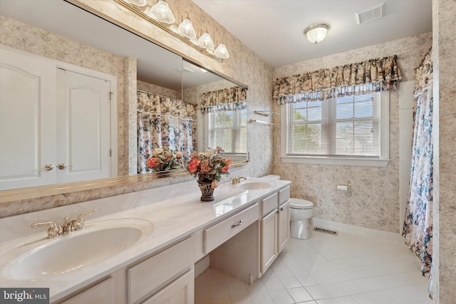 full bathroom featuring tile patterned flooring, toilet, double vanity, wallpapered walls, and curtained shower