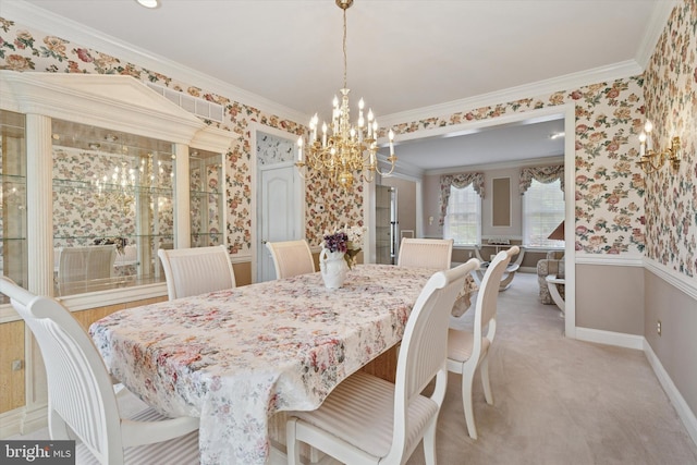 dining area with a chandelier, baseboards, ornamental molding, wallpapered walls, and light carpet