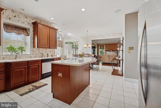 kitchen featuring stainless steel fridge, dishwasher, a chandelier, light countertops, and recessed lighting