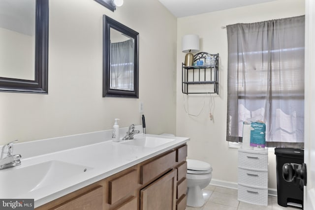 39 Baltic Ct, Inwood, WV 25428 - bathroom featuring tile patterned floors, toilet, double vanity, and baseboards