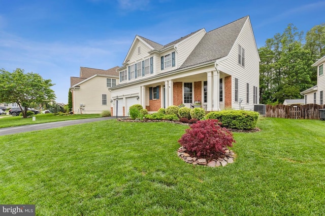 10611 Tattersall Dr, Manassas, VA 20112 - view of front of home featuring an attached garage, asphalt driveway, brick siding, central AC unit, and roof with shingles