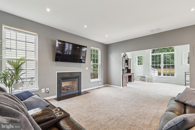 10611 Tattersall Dr, Manassas, VA 20112 - living room featuring carpet flooring, baseboards, plenty of natural light, a fireplace with flush hearth, and recessed lighting