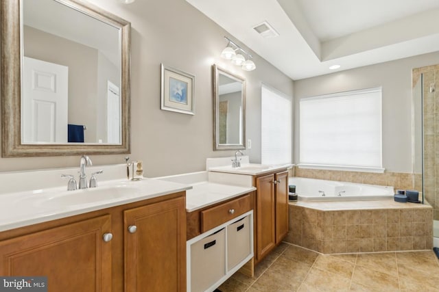 10611 Tattersall Dr, Manassas, VA 20112 - bathroom with vanity, a tub with jets, and tile patterned floors