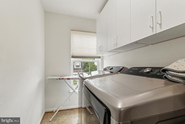 10611 Tattersall Dr, Manassas, VA 20112 - washroom with washing machine and clothes dryer, cabinet space, and baseboards