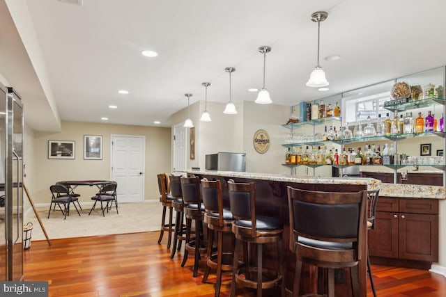 10611 Tattersall Dr, Manassas, VA 20112 - indoor bar featuring dark wood-type flooring, recessed lighting, decorative light fixtures, and baseboards