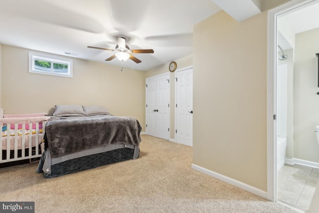 10611 Tattersall Dr, Manassas, VA 20112 - carpeted bedroom with multiple closets, baseboards, and a ceiling fan