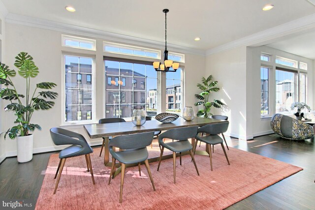 23109 Cottonwillow Sq, Brambleton, VA 20148 - dining room with baseboards, wood finished floors, crown molding, a chandelier, and recessed lighting