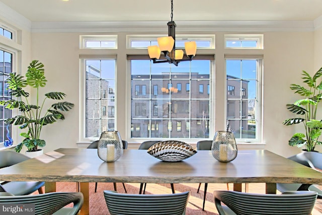 23109 Cottonwillow Sq, Brambleton, VA 20148 - dining area featuring a chandelier and ornamental molding