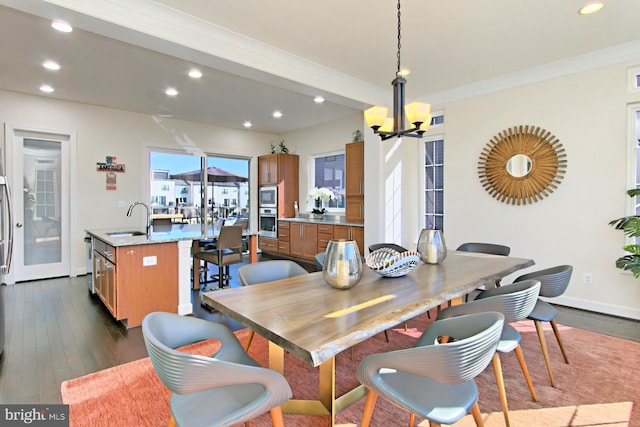 23109 Cottonwillow Sq, Brambleton, VA 20148 - dining space with recessed lighting, dark wood finished floors, a chandelier, and baseboards