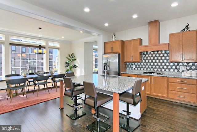 23109 Cottonwillow Sq, Brambleton, VA 20148 - kitchen featuring custom exhaust hood, stainless steel fridge, gas cooktop, a sink, and light stone counters