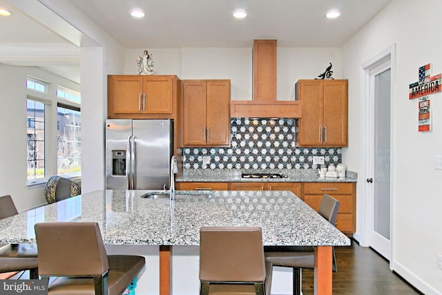 23109 Cottonwillow Sq, Brambleton, VA 20148 - kitchen with appliances with stainless steel finishes, a sink, custom range hood, recessed lighting, and decorative backsplash