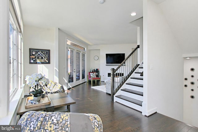 23109 Cottonwillow Sq, Brambleton, VA 20148 - entrance foyer with french doors, wood finished floors, stairs, and healthy amount of natural light