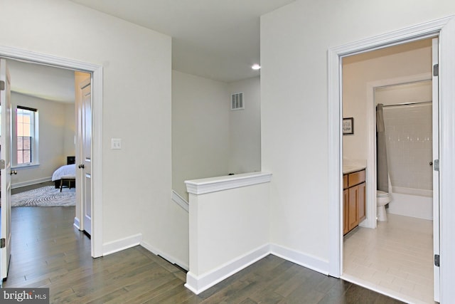 23109 Cottonwillow Sq, Brambleton, VA 20148 - corridor with dark wood-style floors, an upstairs landing, baseboards, and recessed lighting