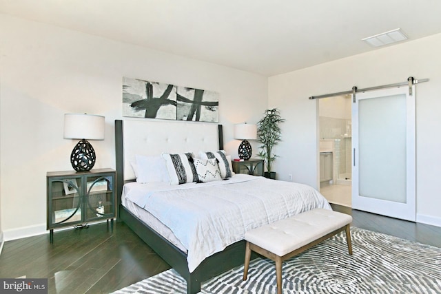 23109 Cottonwillow Sq, Brambleton, VA 20148 - bedroom featuring a barn door, wood finished floors, baseboards, and ensuite bathroom