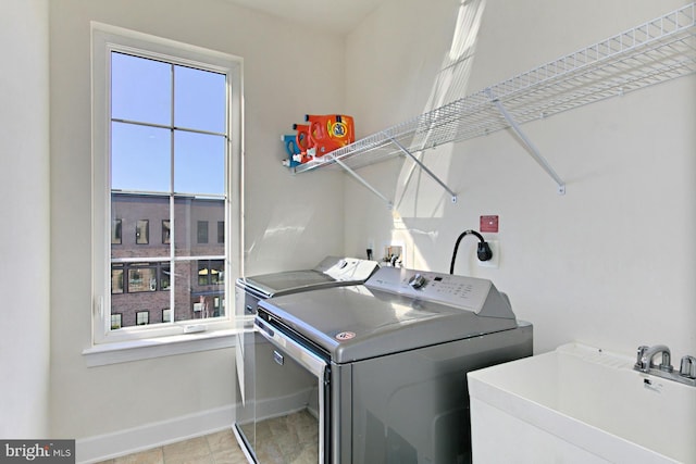 23109 Cottonwillow Sq, Brambleton, VA 20148 - washroom with washing machine and dryer and baseboards