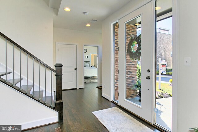 23109 Cottonwillow Sq, Brambleton, VA 20148 - foyer featuring dark wood-type flooring, plenty of natural light, stairs, recessed lighting, and baseboards