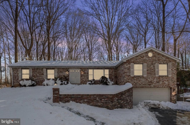 14863 Prestige Dr, Woodbridge, VA 22193 - view of front of property with an attached garage and brick siding