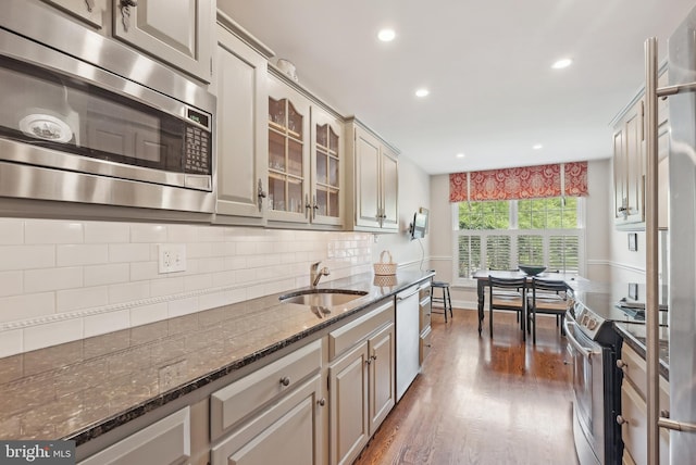 36 Wingstone Ln, Devon, PA 19333 - kitchen featuring appliances with stainless steel finishes, a sink, wood finished floors, recessed lighting, and dark stone countertops