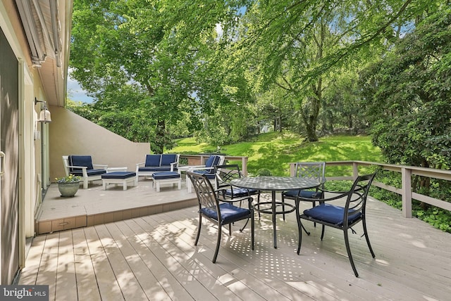 36 Wingstone Ln, Devon, PA 19333 - wooden deck featuring an outdoor living space, outdoor dining area, and view of scattered trees