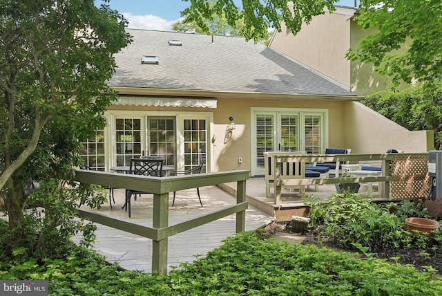 36 Wingstone Ln, Devon, PA 19333 - back of property featuring a shingled roof, a deck, and stucco siding