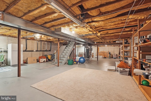 36 Wingstone Ln, Devon, PA 19333 - unfinished below grade area featuring freestanding refrigerator, stairway, and heating unit