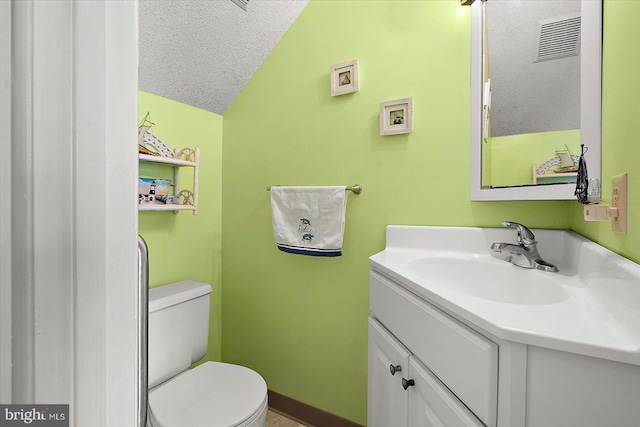 614 Osprey Rd Unit D, Ocean City, MD 21842 - bathroom with vaulted ceiling, a textured ceiling, toilet, and vanity