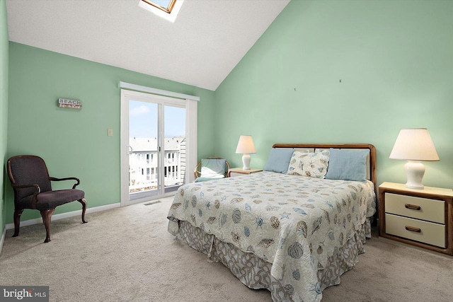 614 Osprey Rd Unit D, Ocean City, MD 21842 - bedroom with carpet floors, access to outside, baseboards, a skylight, and high vaulted ceiling