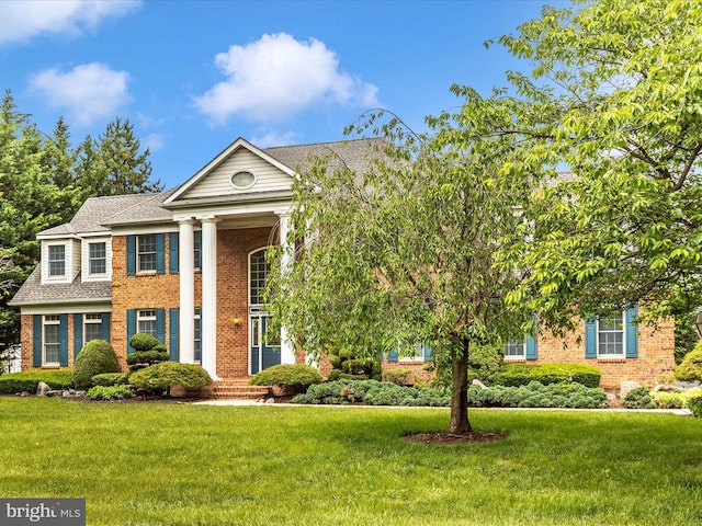 18806 Fountain Ter, Hagerstown, MD 21742 - neoclassical home with brick siding, a front lawn, and a shingled roof
