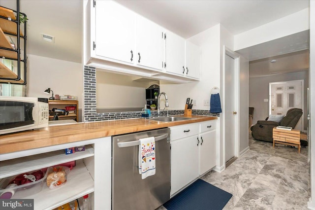 10625 Shasta Ct Unit T, Damascus, MD 20872 - kitchen with stainless steel dishwasher, white microwave, a sink, white cabinets, and wood counters