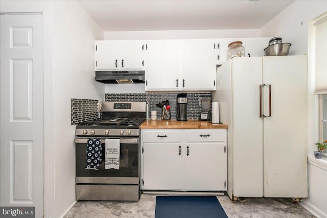 10625 Shasta Ct Unit T, Damascus, MD 20872 - kitchen with gas stove, freestanding refrigerator, under cabinet range hood, white cabinets, and decorative backsplash