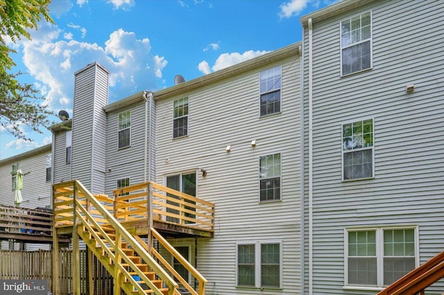 10625 Shasta Ct Unit T, Damascus, MD 20872 - back of house with stairs, a wooden deck, and a chimney