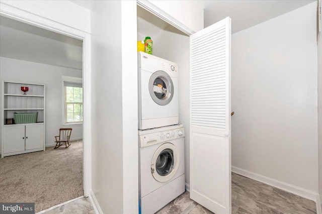 10625 Shasta Ct Unit T, Damascus, MD 20872 - washroom featuring stacked washer and clothes dryer and baseboards