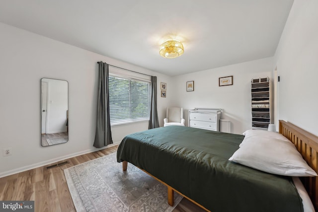 10707 Muirfield Dr, Potomac, MD 20854 - bedroom featuring wood finished floors and baseboards