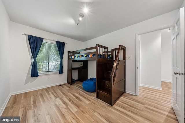 10707 Muirfield Dr, Potomac, MD 20854 - unfurnished bedroom with light wood-type flooring and baseboards