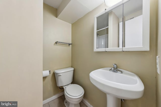 10707 Muirfield Dr, Potomac, MD 20854 - bathroom with toilet, tile patterned floors, baseboards, and a sink