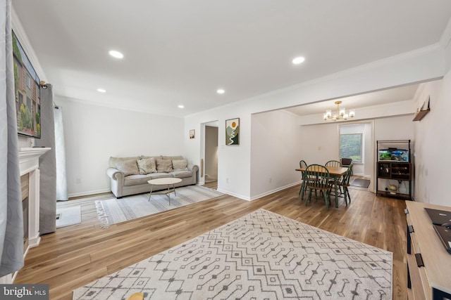 10707 Muirfield Dr, Potomac, MD 20854 - living room featuring ornamental molding, wood finished floors, a chandelier, baseboards, and recessed lighting