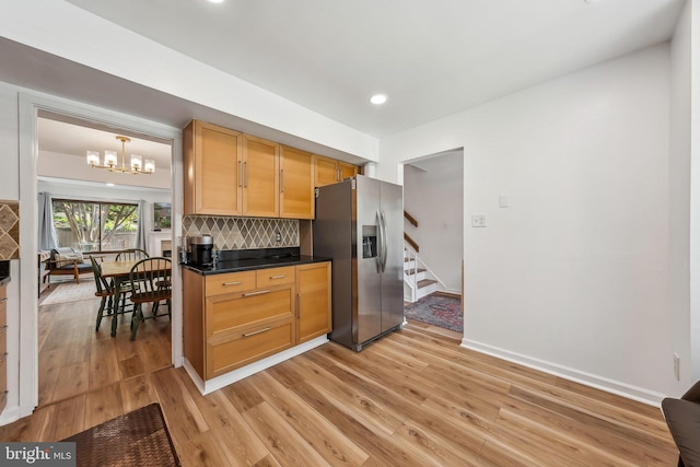 10707 Muirfield Dr, Potomac, MD 20854 - kitchen with stainless steel fridge, light wood-type flooring, decorative backsplash, a chandelier, and recessed lighting
