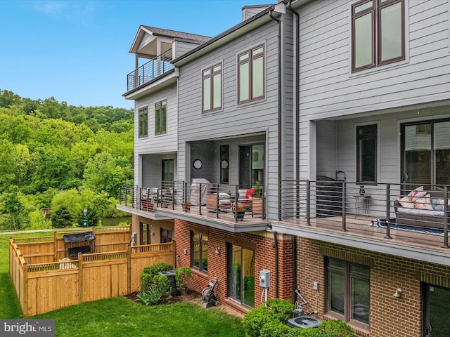 rear view of house with a balcony