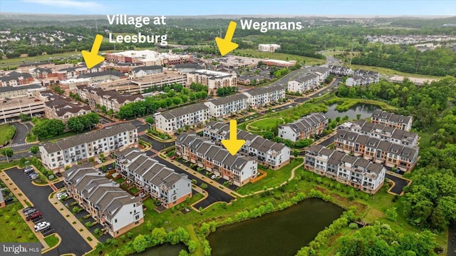 aerial view of property's location with a large body of water