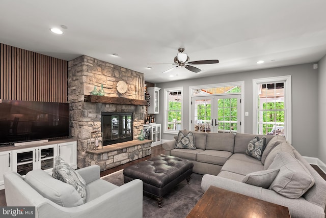 living room with healthy amount of natural light, a ceiling fan, recessed lighting, baseboards, and a fireplace