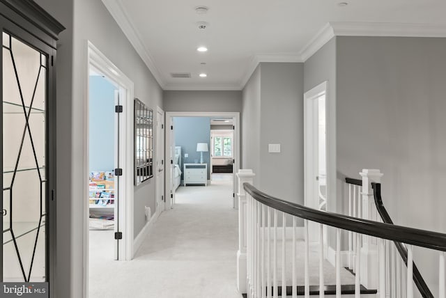 corridor with an upstairs landing, light colored carpet, recessed lighting, crown molding, and baseboards